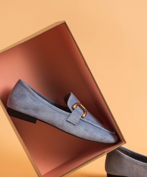 a pair of shoes sitting inside of a box