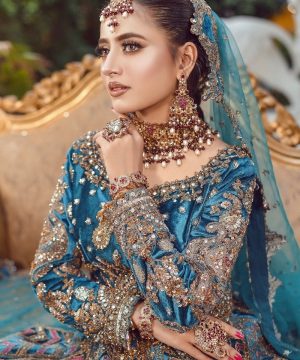 A bride in a beautiful, elaborate, and expensive outfit.